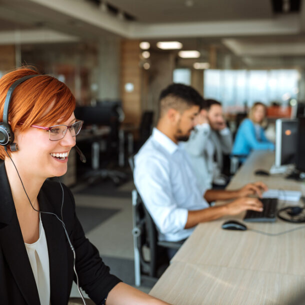 BDC agents working at thier desks with headphones on