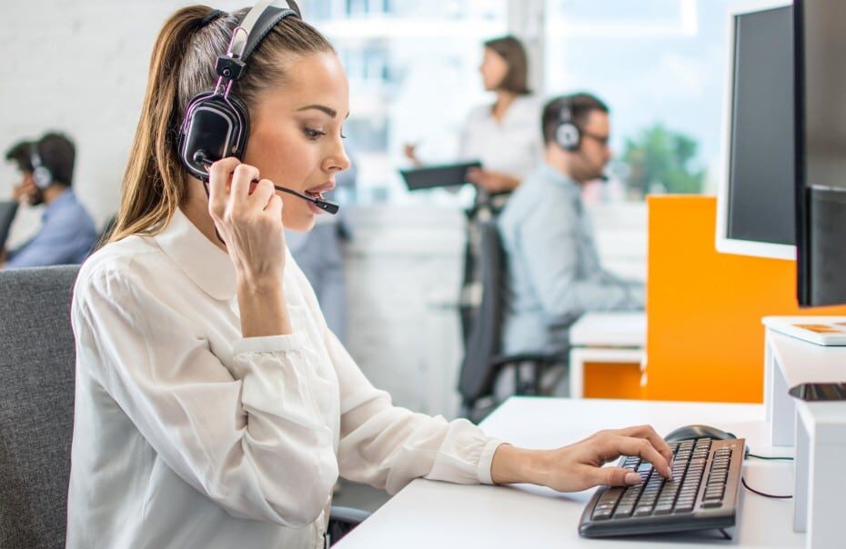 call center agent at desk with headset
