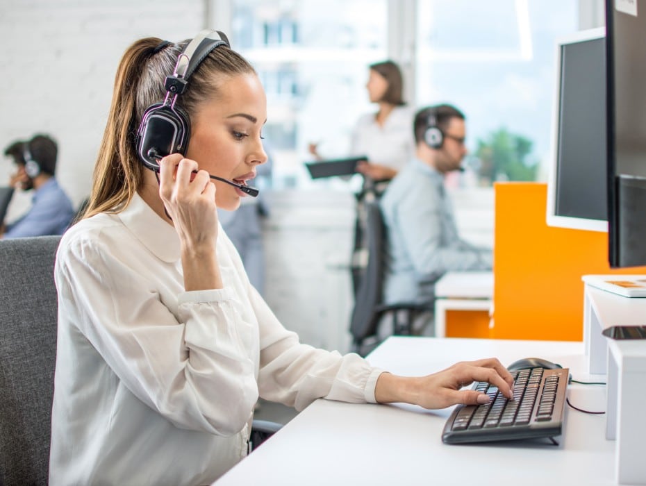 call center agent at desk with headset