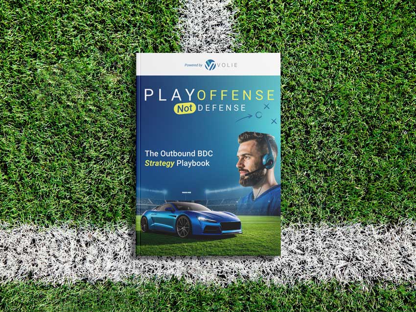 ebook of the Volie campaign Play Offense Not Defense laying on a football field.