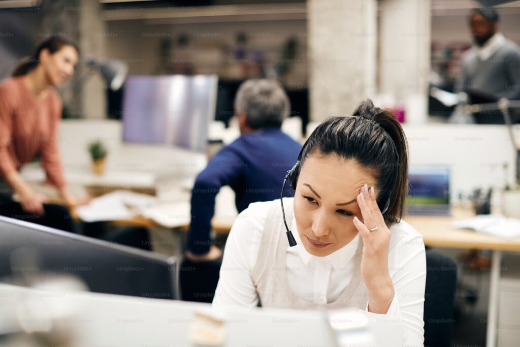 bdc worker experiencing burnout at call center desk