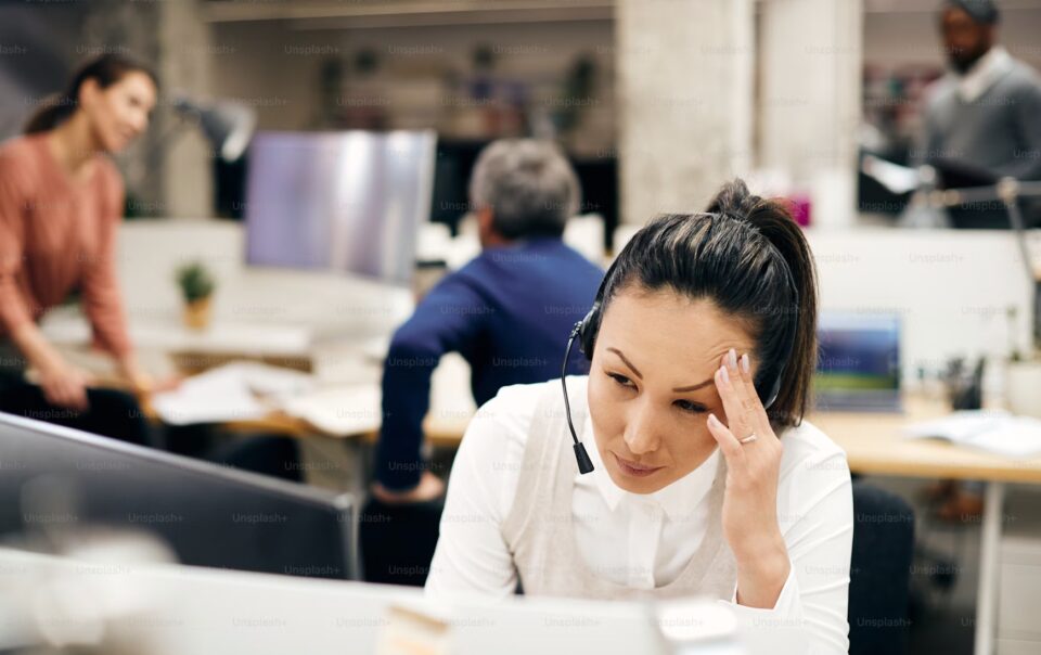 bdc worker experiencing burnout at call center desk