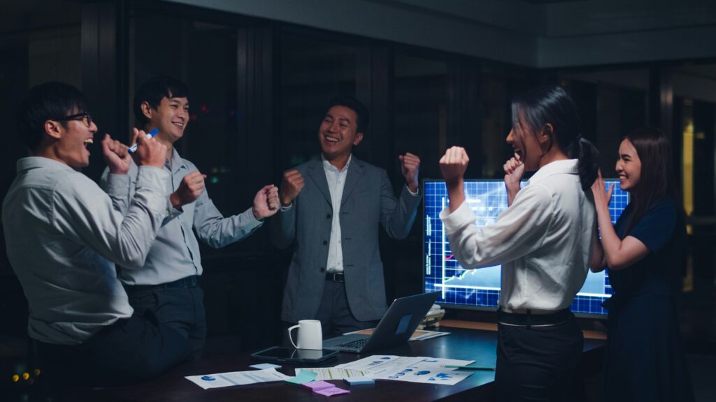 bdc team celebrating success in conference room