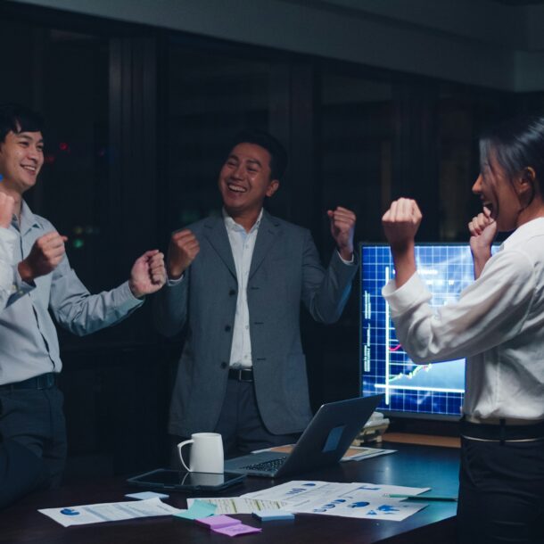 bdc team celebrating success in conference room