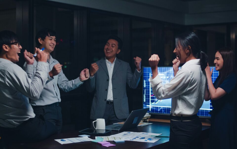 bdc team celebrating success in conference room