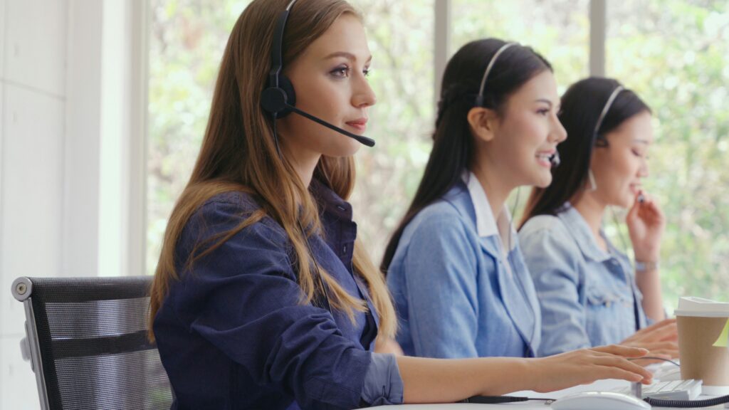 offense bdc agents with head sets at desk